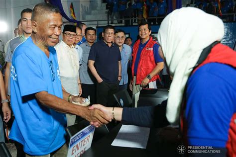 President Rodrigo Roa Duterte interacts with the guests during the launch of the second phase of ...