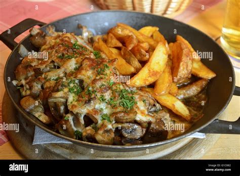 Pork steak with fried mushrooms Stock Photo - Alamy