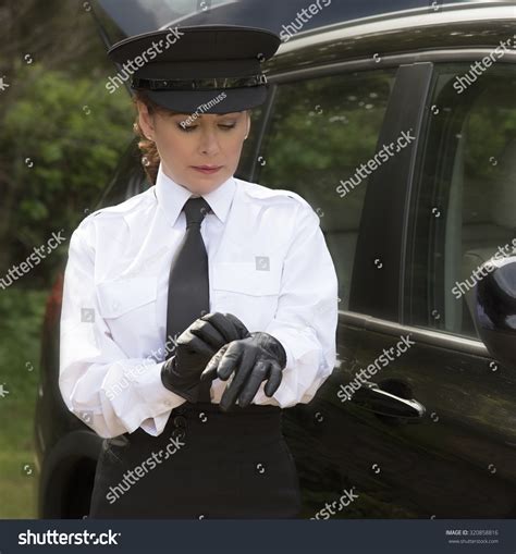 Woman Chauffeur Putting On Her Uniform Stock Photo 320858816 | Shutterstock