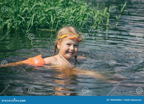 A Child Bathes in a Summer River Stock Photo - Image of active, cute: 190044984