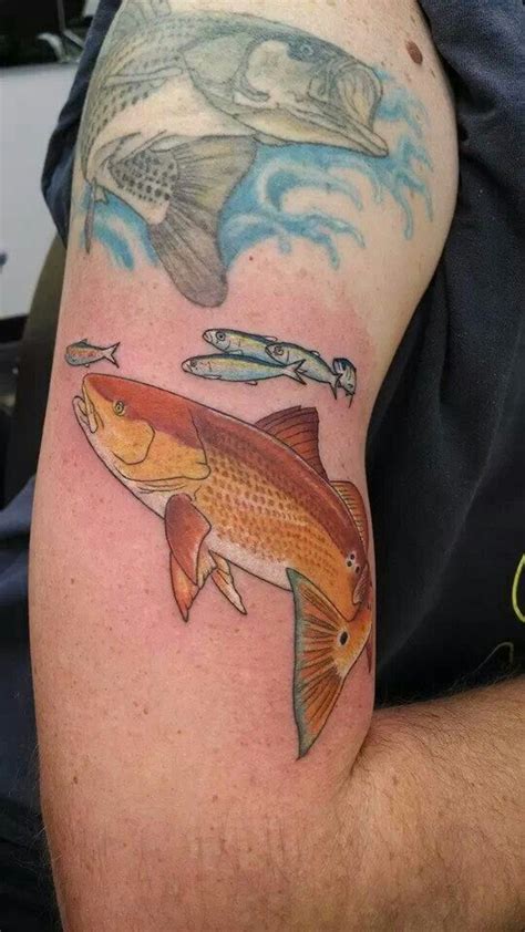 My husband just finished another part of his "saltwater" half sleeve rock fish on top, red drum ...