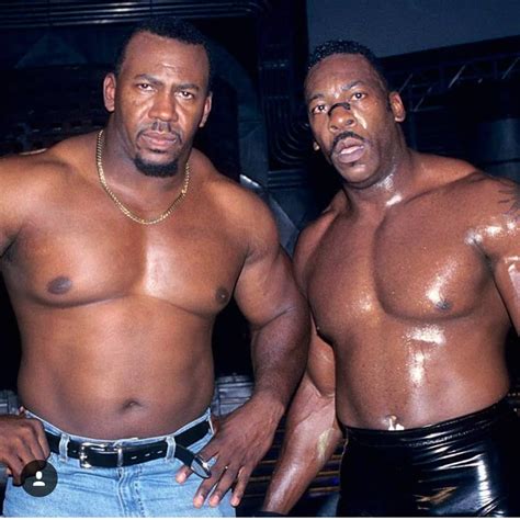 Classic photo of WWE Hall of Fame legend Booker T (Booker Huffman) with his older brother Stevie ...