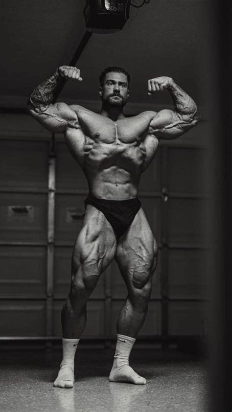 Download Chris Bumstead Dobbelt Front Bicep Pose Wallpaper | Wallpapers.com