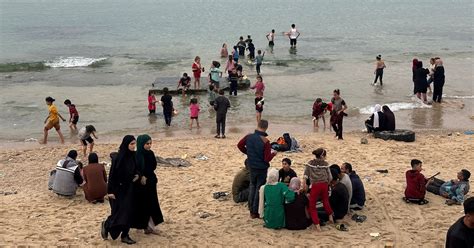 Tears and laughter on Gaza beach as children get break from war | Reuters