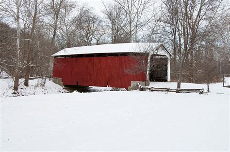 Covered Bridge In Snow Covered Forest Photograph by Panoramic Images - Fine Art America