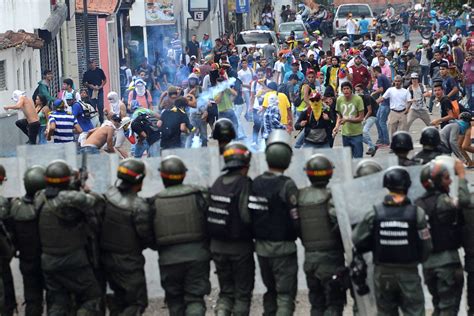 Venezuelan police officer shot dead and dozens injured as protests ...