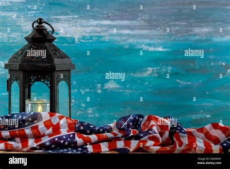 Lighted candle with an American flag, turquoise background Stock Photo - Alamy