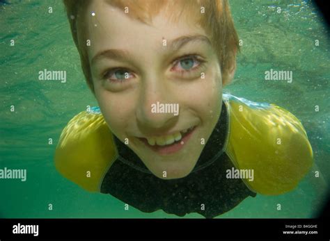 young boy swimming underwater Stock Photo - Alamy