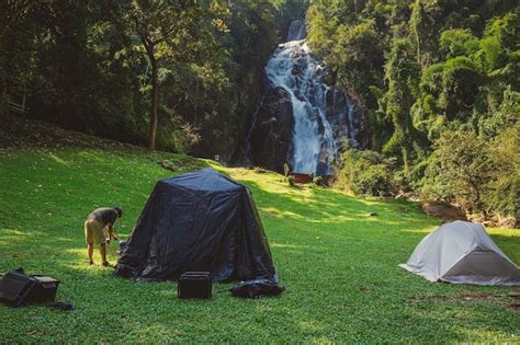 Premium Photo | Camping waterfall in front of the waterfall