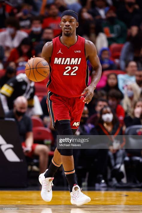 Jimmy Butler of the Miami Heat dribbles up the court against the ...