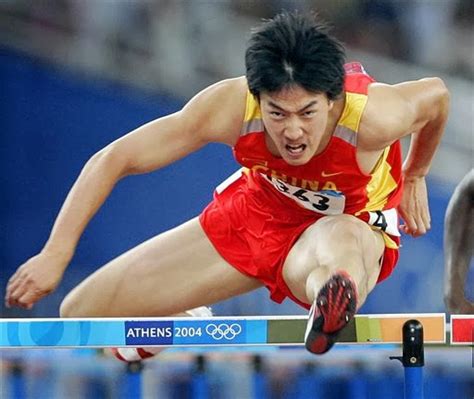 Male Athletes World: Track and field: Liu Xiang racing 110m hurdles at Athens 2004 Olympics