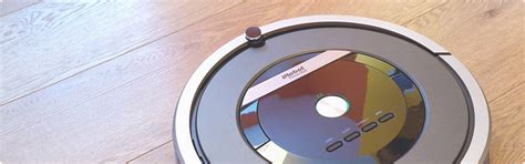 How do I replace the battery in my Roomba vacuum cleaner?