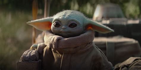 Dwayne Johnson Snuggles The Mandalorian's Baby Yoda In Fan Art