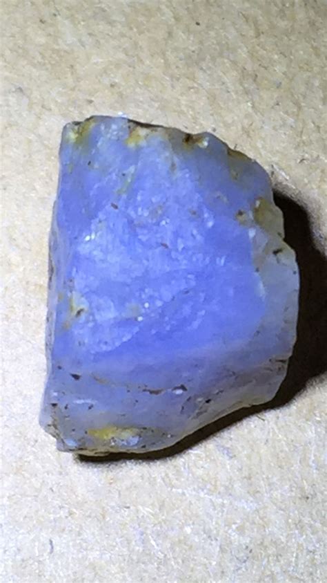 a blue rock sitting on top of a counter