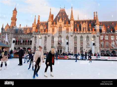 Bruges winter; People ice skating in the Market square ( markt square ...