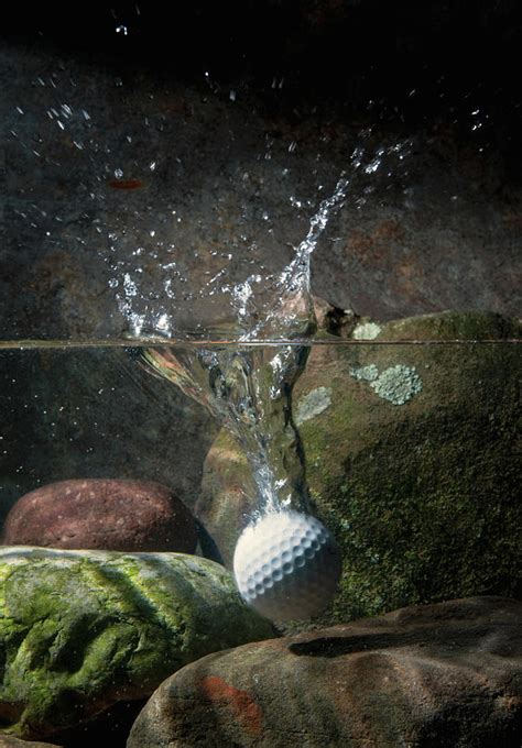 Golf Ball Hits Water Hazard by Pm Images