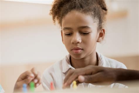 Premium Photo | Thoughtful africanamerican girl playing board game