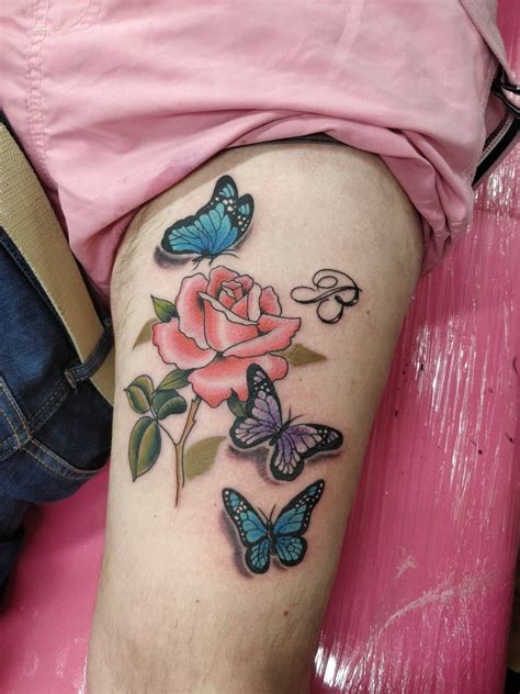 Rose and butterfly's | Rose tattoos, Butterfly tattoo, Cool tattoos