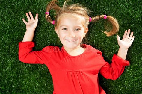 Little Girl Smiling on Grass Stock Photo - Image of childhood, little: 22330492