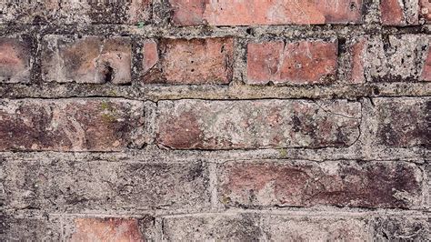 Vintage Brick Wall In Closeup A Textured Background Of Bricks Photo And ...