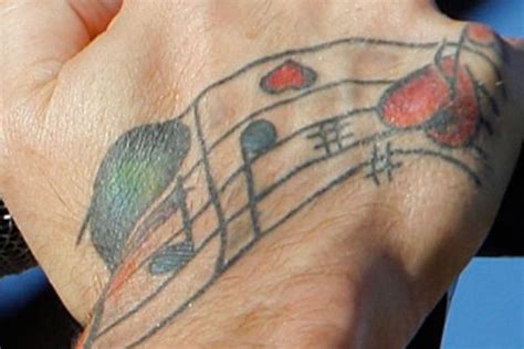 I LOVE Gary's music tattoo on his hand, especially with the red hearts ...