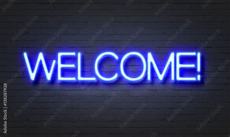 Welcome neon sign on brick wall background. Stock Illustration | Adobe Stock