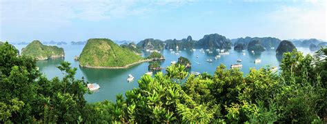 Panorama of Ha Long Bay islands, tourist boat and seascape, Ha L Photograph by Vichai ...