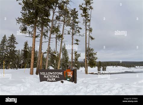 Yellowstone national park entrance sign in winter Stock Photo - Alamy