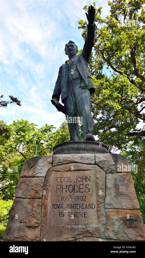 Statue of Cecil Rhodes (2016) African coloniser, wearing a 3-piece suit,standing with his left ...