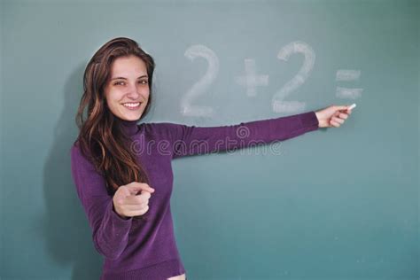 Math Teacher In Front Of Blackboard Stock Photography - Image: 16833692