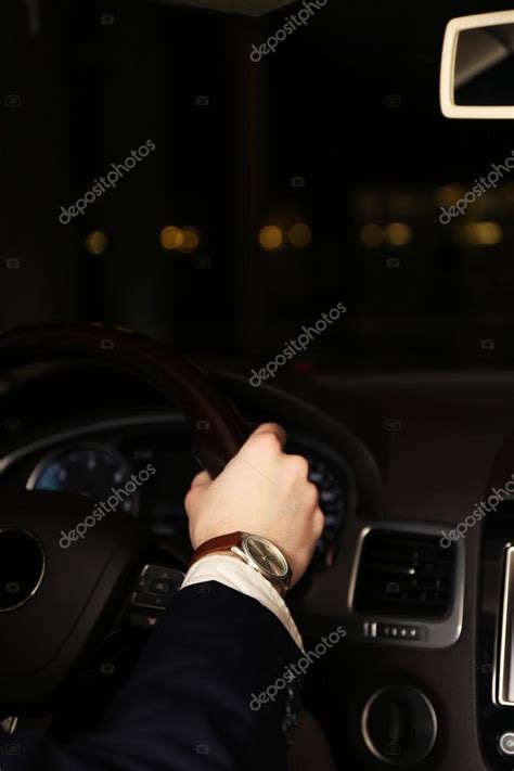 Man driving his modern car at night in city, close-up — Stock Photo ...