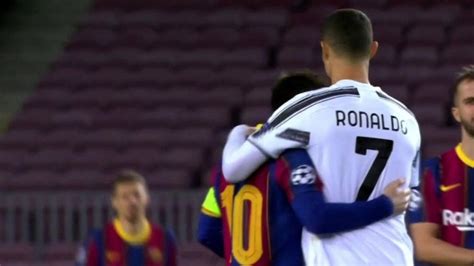 Messi and Ronaldo hug each other before the game