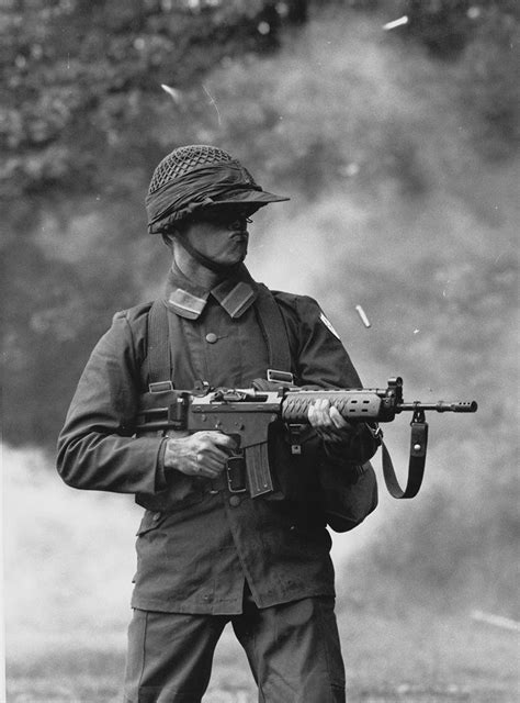 A Swedish soldier firing the then, newly issued AK5 (FN FNC) on full auto. Late 1980’s. Military ...