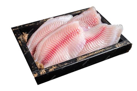 Premium Photo | Fresh tilapia white fish fillet in a wooden tray ...