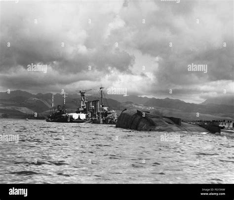 WWII: PEARL HARBOR, 1941. /nA view of the capsized USS Utah and the USS Raleigh, after the ...