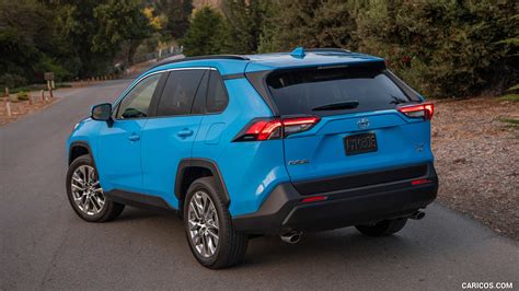 2019 Toyota RAV4 XLE Premium AWD (Color: Blue Flame) - Rear Three-Quarter | Caricos