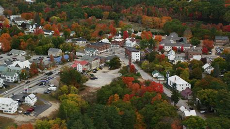 5.5K stock footage aerial video orbiting small rural town with colorful ...