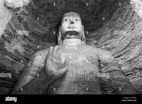 China, Shanxi Province, Datong, Ancient Buddhist sculptures within Cave 18 inside Yungang Buddha ...