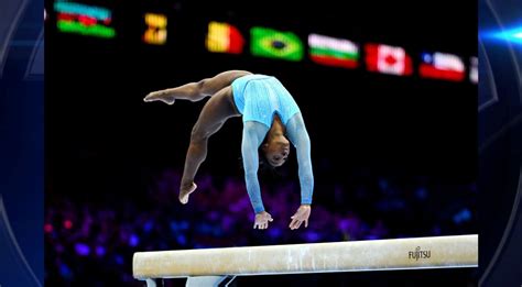 Simone Biles makes history on opening day of qualifying at World ...