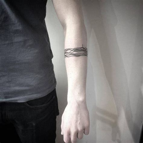 Abstract armband tattoo on the left forearm. | Line tattoos, Arm band tattoo, Arm tattoos for guys