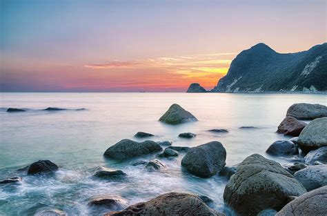 Calm Sunset At Ihama Rocky Beach by Tommy Tsutsui