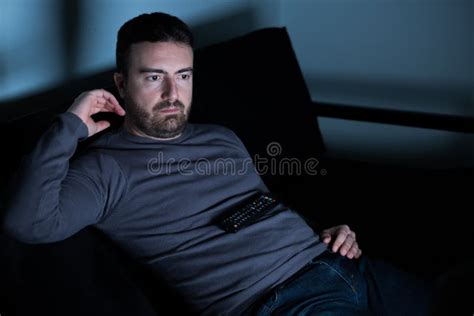 Man Watching Television on the Couch Stock Photo - Image of show ...