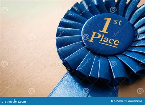 Blue First Place Winner Rosette Stock Image - Image of angle, background: 44738187