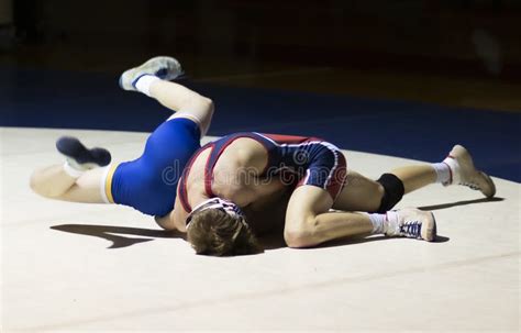 High School Boys Wrestling Under a Spotlight Stock Photo - Image of ...