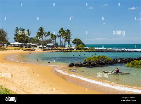 People enjoying a swim at Bargara Beach, Bundaberg, Queensland, Australia Stock Photo - Alamy