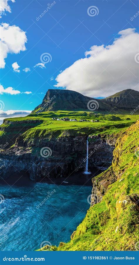 View of Gasadalur Waterfall Cascading into the Sea Stock Image - Image of islands, background ...