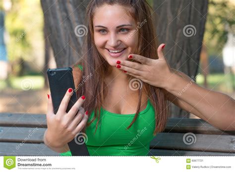 Girl Listening Music with Headphones and Holding a Smartphone Stock Image - Image of music ...