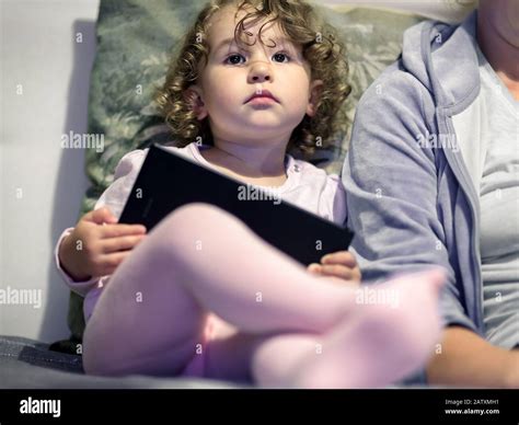 Baby touching television hi-res stock photography and images - Alamy