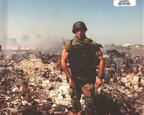 An FBI agent poses amidst the ruins of the Branch Davidian compound in ...