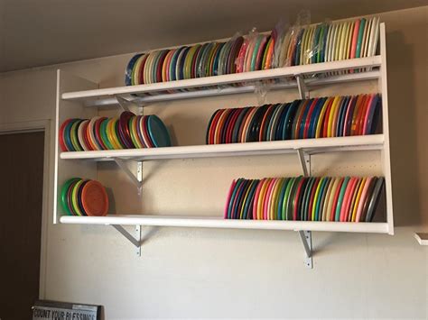 Disc rack 2.0. Wife asked if I could make a new rack with more room and a lower shelf. I even ...